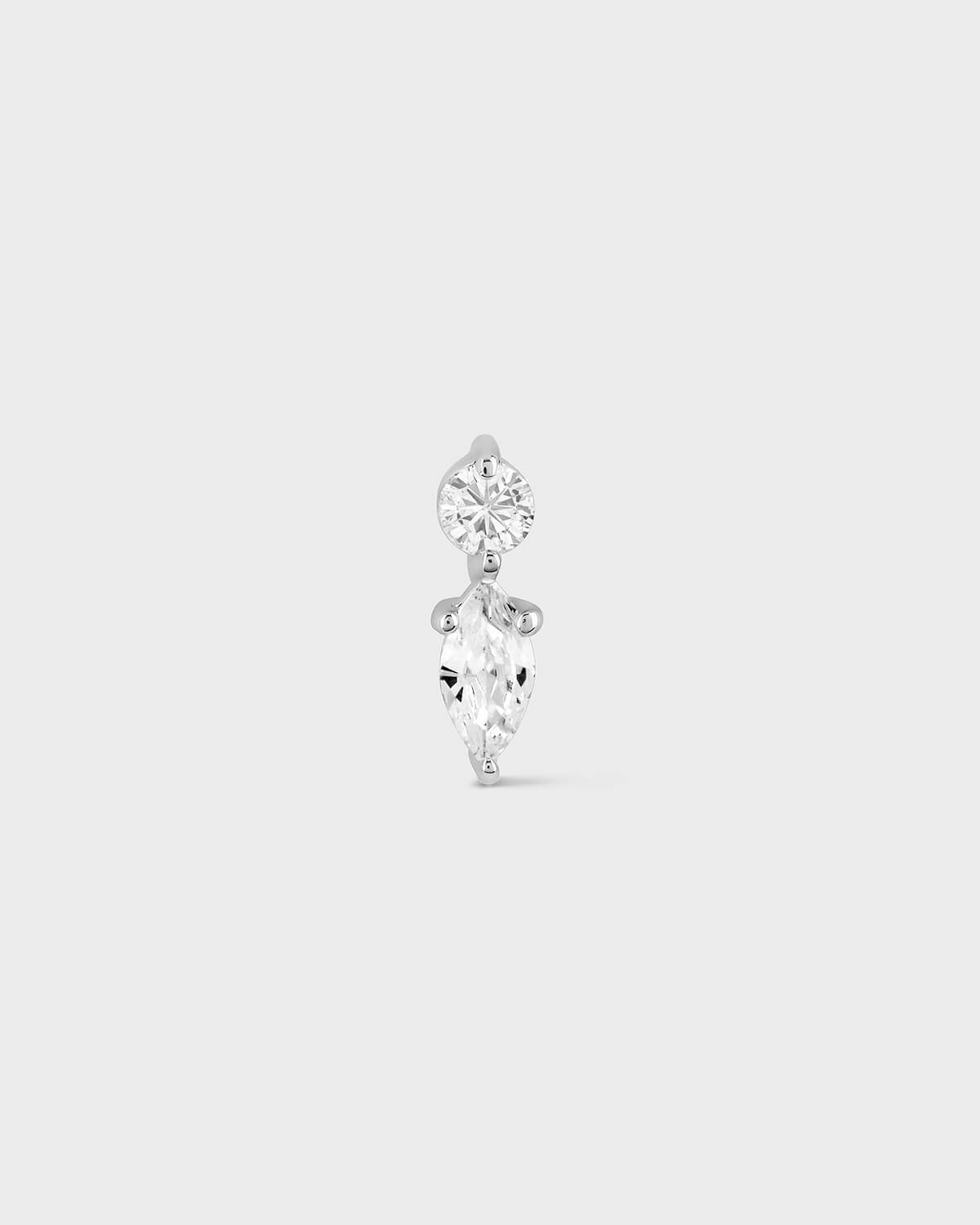 Diamond earring on a light gray background