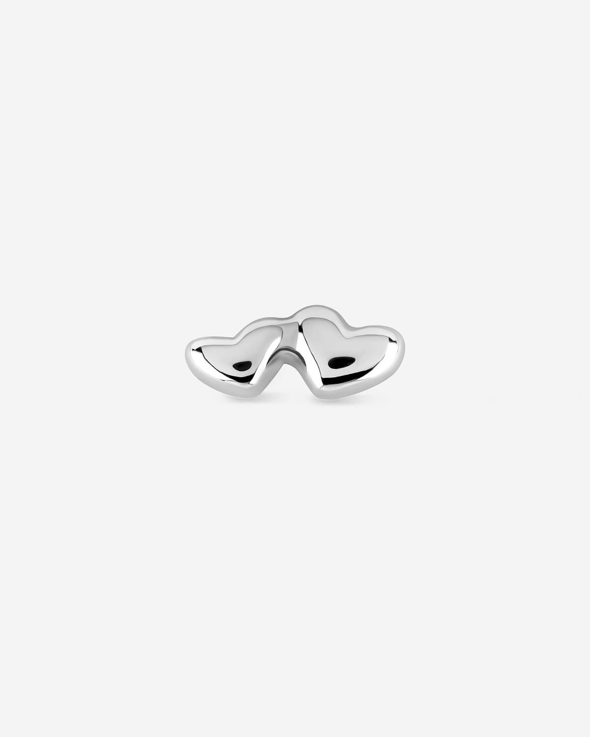 Silver heart-shaped earring on a white background