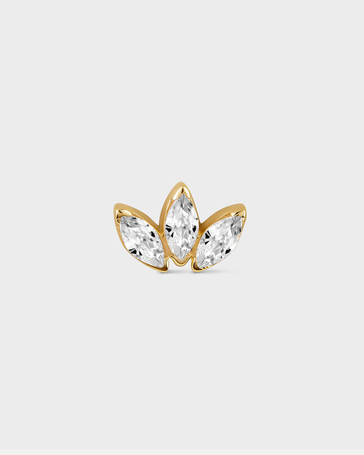 Gold butterfly-shaped earring with clear gemstones on a light gray background