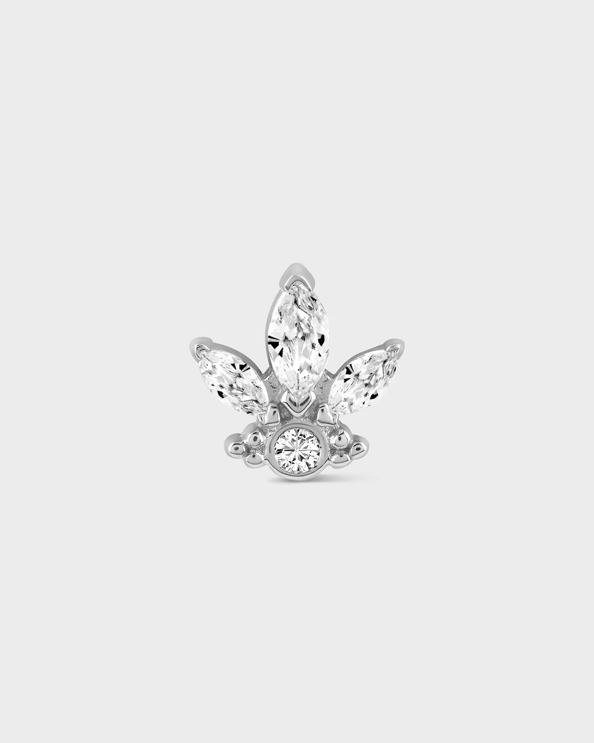 Butterfly-shaped earring with clear gemstones on a light gray background
