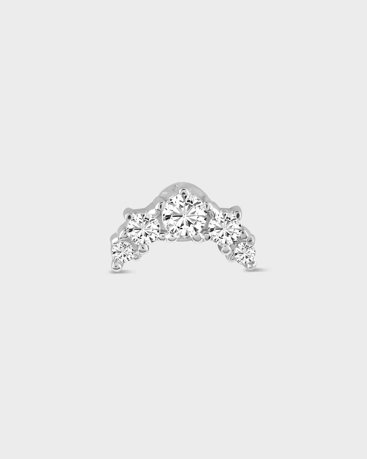 Diamond ring with a curved band on a light gray background