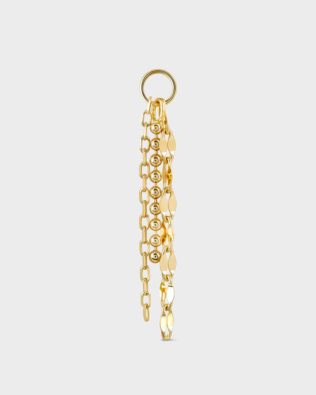 Gold chain earring on a light gray background