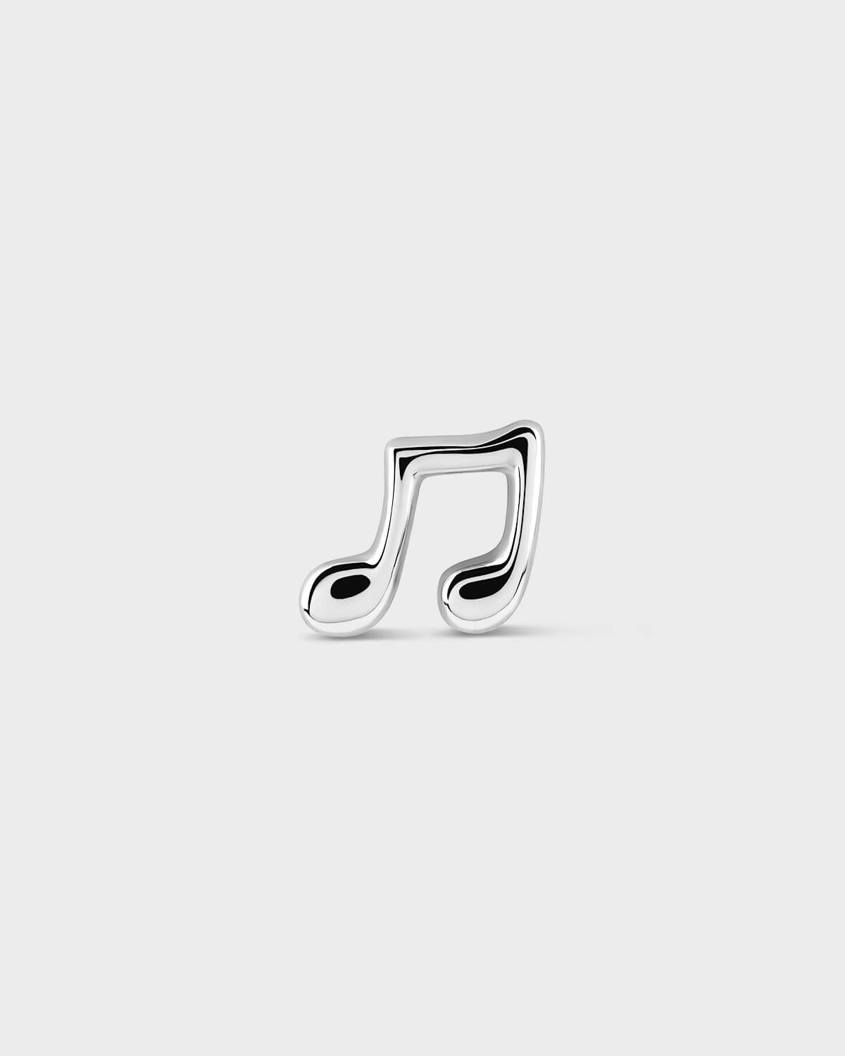 Silver music note charm on a light gray background