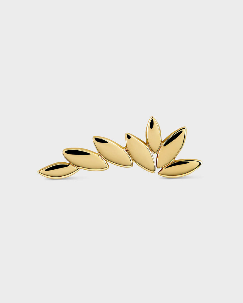 Gold wing-shaped earrings on a light gray background