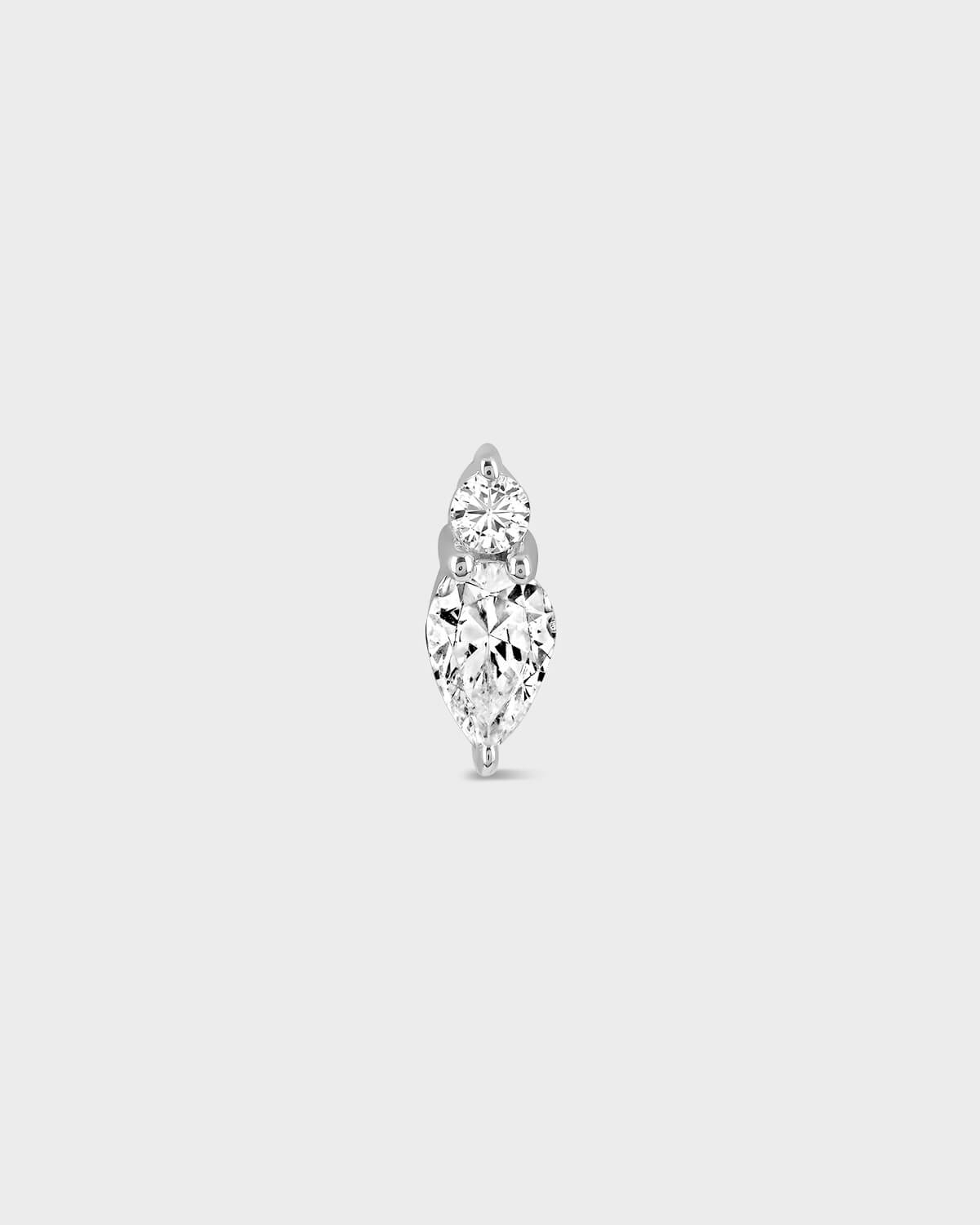 pear-shaped diamond earring on a light gray background
